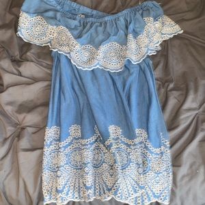 Large blue off the shoulder shirt with white designs